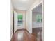 Bright entryway with hardwood floors, white trim, and a view into the adjacent living space at 1952 Winding Creek Sw Ln, Marietta, GA 30064