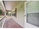 Inviting front porch with wood decking, white railing, and a view of the surrounding greenery at 1952 Winding Creek Sw Ln, Marietta, GA 30064