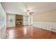 Bright living area with a ceiling fan, a stone fireplace, and large windows at 1952 Winding Creek Sw Ln, Marietta, GA 30064