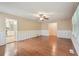 Open living space featuring hardwood floors, neutral walls, and easy access to the kitchen at 1952 Winding Creek Sw Ln, Marietta, GA 30064