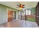 Relax on this screened-in patio, complete with a ceiling fan and sliding glass doors leading to the interior at 1952 Winding Creek Sw Ln, Marietta, GA 30064