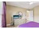 Bedroom with a dresser, decorative mirror, ceiling fan, and purple curtains at 2851 Weatherstone Se Cir, Conyers, GA 30094