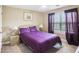 Bedroom with a bed, side tables, lamps, ceiling fan, and natural light from the window at 2851 Weatherstone Se Cir, Conyers, GA 30094
