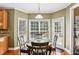 Breakfast nook featuring a round table, large windows, and access to the patio at 2851 Weatherstone Se Cir, Conyers, GA 30094