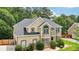 Beautiful two-story home featuring manicured landscaping, neutral stucco facade, and elegant architectural details at 2851 Weatherstone Se Cir, Conyers, GA 30094