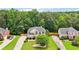 Beautiful two-story home with manicured lawn, mature trees, and a spacious driveway at 2851 Weatherstone Se Cir, Conyers, GA 30094