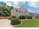 Charming two-story home with a well-maintained lawn, mature trees, and a side-entry garage at 2851 Weatherstone Se Cir, Conyers, GA 30094