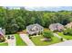 Lovely two-story home with manicured lawn, mature trees, and a spacious driveway for multiple vehicles at 2851 Weatherstone Se Cir, Conyers, GA 30094