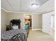 Spacious finished basement with table and view to the storage room at 2851 Weatherstone Se Cir, Conyers, GA 30094