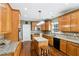 Spacious kitchen featuring custom cabinets, granite countertops, and stainless steel appliances at 2851 Weatherstone Se Cir, Conyers, GA 30094