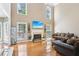 Spacious living room featuring a fireplace, hardwood floors, and large windows at 2851 Weatherstone Se Cir, Conyers, GA 30094