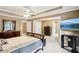 Large main bedroom featuring tray ceilings, neutral carpeting, and ample space for furniture at 2851 Weatherstone Se Cir, Conyers, GA 30094