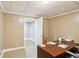 Bright office space with neutral paint, trim and an open doorway to the carpeted hallway at 2851 Weatherstone Se Cir, Conyers, GA 30094