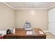 Bright office space with neutral paint, trim and a spacious wooden desk, perfect for a home-based professional at 2851 Weatherstone Se Cir, Conyers, GA 30094