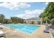 Outdoor pool with chairs for lounging on the deck at 2851 Weatherstone Se Cir, Conyers, GA 30094