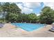 Outdoor pool area featuring a large swimming pool with chairs for relaxing poolside at 2851 Weatherstone Se Cir, Conyers, GA 30094