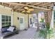 Cozy back porch featuring a ceiling fan, neutral-toned curtains, and comfortable seating at 2851 Weatherstone Se Cir, Conyers, GA 30094