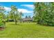 Spacious backyard with lush green grass and mature trees at 4477 Timber Ridge Dr, Douglasville, GA 30135
