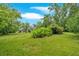 Large backyard with lush grass and mature trees at 4477 Timber Ridge Dr, Douglasville, GA 30135