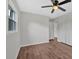 Bedroom with hardwood floors, a ceiling fan, a window and a double closet at 4477 Timber Ridge Dr, Douglasville, GA 30135