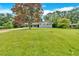 Well-maintained front lawn and a charming, painted one-story home with fresh landscaping at 4477 Timber Ridge Dr, Douglasville, GA 30135