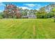 Expansive front lawn leading to a charming one-story home with mature trees and fresh landscaping at 4477 Timber Ridge Dr, Douglasville, GA 30135