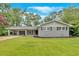 Charming single-story home with grey brick and a well-manicured lawn at 4477 Timber Ridge Dr, Douglasville, GA 30135