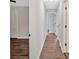 Hallway with wood-look floors connecting the various rooms of the home at 4477 Timber Ridge Dr, Douglasville, GA 30135