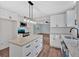 Kitchen with white cabinets, granite countertops, a modern island with an eat in bar, and stainless appliances at 4477 Timber Ridge Dr, Douglasville, GA 30135