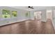 Spacious living room with wood-look floors, a ceiling fan, and an open concept layout at 4477 Timber Ridge Dr, Douglasville, GA 30135