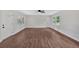 Spacious living room featuring wood-look floors, a ceiling fan, and neutral paint at 4477 Timber Ridge Dr, Douglasville, GA 30135