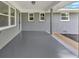Covered patio with painted brick and ample natural light shining through windows at 4477 Timber Ridge Dr, Douglasville, GA 30135