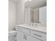 Bright bathroom with modern fixtures, a mirror, and a toilet at 631 Skytop Dr, Cumming, GA 30040