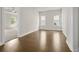 Bedroom featuring hardwood floors, large window, and ceiling fan at 631 Skytop Dr, Cumming, GA 30040