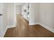 Spacious hallway features hardwood floors and leads to the bright, open living areas of the home at 631 Skytop Dr, Cumming, GA 30040