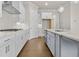 Bright kitchen features white cabinets, stainless steel appliances, and a gray island with modern finishes at 631 Skytop Dr, Cumming, GA 30040