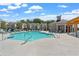 Beautiful community pool with sun loungers, cabana, and well-maintained deck area at 631 Skytop Dr, Cumming, GA 30040