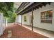 Spacious outdoor area beneath a deck, featuring a patio and natural landscaping with pine straw at 2072 Castleway Ne Dr, Atlanta, GA 30345