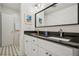 Modern bathroom vanity with granite countertop and dual sinks at 2072 Castleway Ne Dr, Atlanta, GA 30345