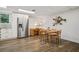 Bright dining area with stainless steel refrigerator and laminate flooring at 2072 Castleway Ne Dr, Atlanta, GA 30345