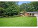 Charming ranch-style home with well-manicured lawn and mature trees at 2072 Castleway Ne Dr, Atlanta, GA 30345