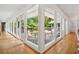 Bright hallway with floor-to-ceiling windows offering great views of the outside deck at 2072 Castleway Ne Dr, Atlanta, GA 30345
