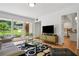 Stylish living room featuring unique decor, a large window, and an open layout at 2072 Castleway Ne Dr, Atlanta, GA 30345