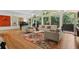 Spacious living room featuring hardwood floors and large windows offering nature views at 2072 Castleway Ne Dr, Atlanta, GA 30345