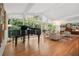 Bright open-concept living room with hardwood floors and grand piano at 2072 Castleway Ne Dr, Atlanta, GA 30345