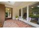 Enclosed patio with brick flooring and plenty of seating to enjoy the views at 2072 Castleway Ne Dr, Atlanta, GA 30345