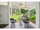 Bright sunroom with floor to ceiling windows and unique decor at 2072 Castleway Ne Dr, Atlanta, GA 30345