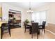 Charming dining area with modern light fixture adjacent to kitchen and overlooking living area at 3785 Glen Ian Dr, Loganville, GA 30052