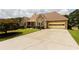 Beautiful home with stone accents, well-manicured lawn, and large driveway at 3785 Glen Ian Dr, Loganville, GA 30052