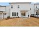 Back of a modern home with a yard and patio at 625 Skytop Dr, Cumming, GA 30040
